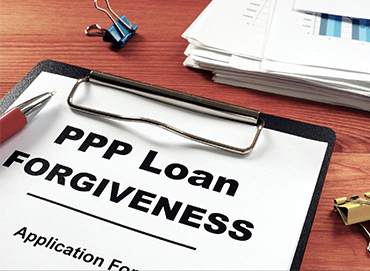 Clipboard with PPP Loan Forgiveness application