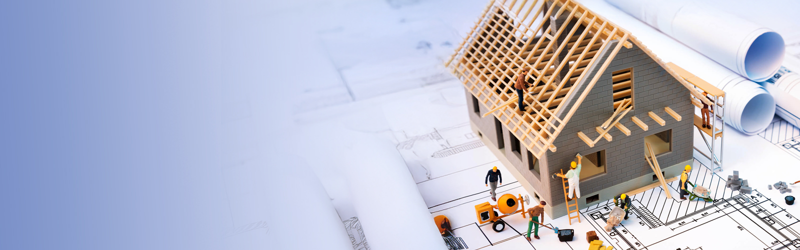 A conceptual graphic of a house being constructed sitting on top of a set of blueprints.
