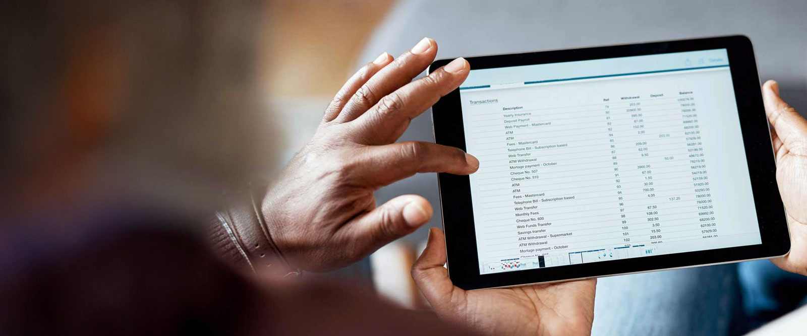 A tablet screen displaying a monthly financial statement.